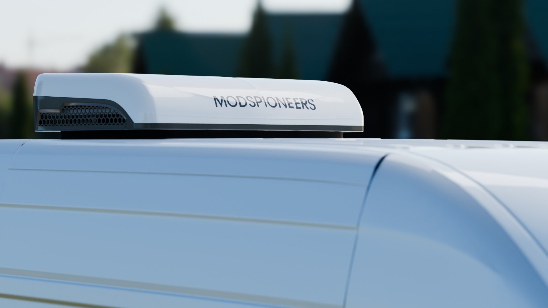 Modspioneers RV AC unit on a van's roof with a blurred background