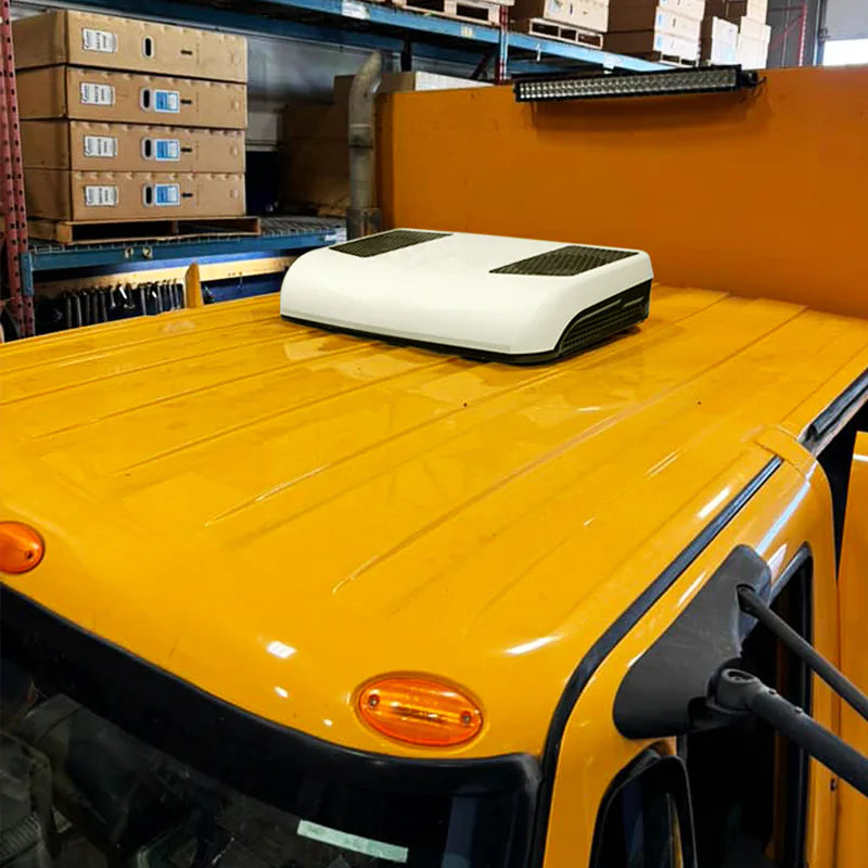 12v ac unit installed on the rooftop of a yellow truck